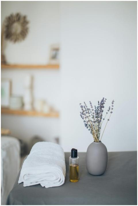 Relaxing spa scene featuring lavender, towel, and