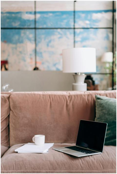 Comfortable home workspace with a laptop and coffe