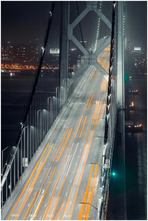 Long exposure shot of traffic lights on an illumin