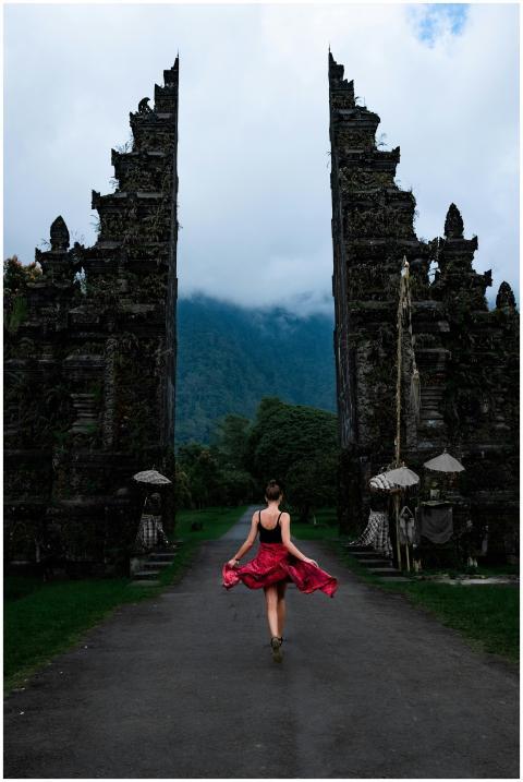 A woman twirls in a red dress at the famous Handar