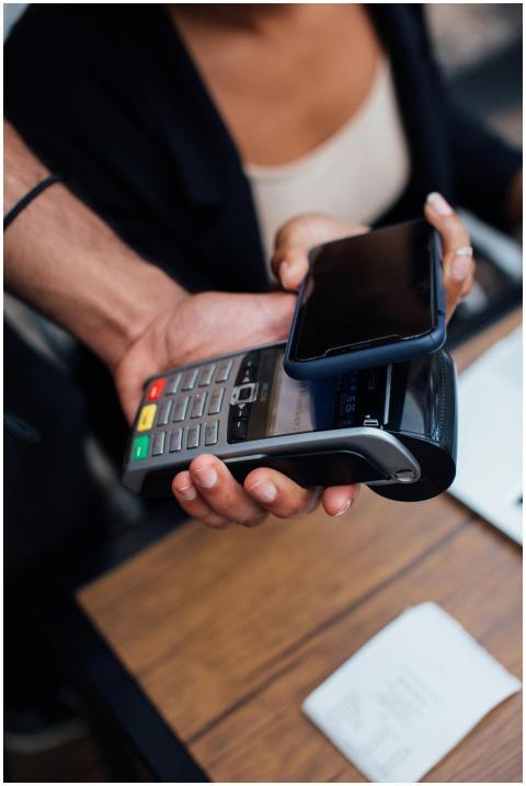 A smartphone is used for a contactless payment on