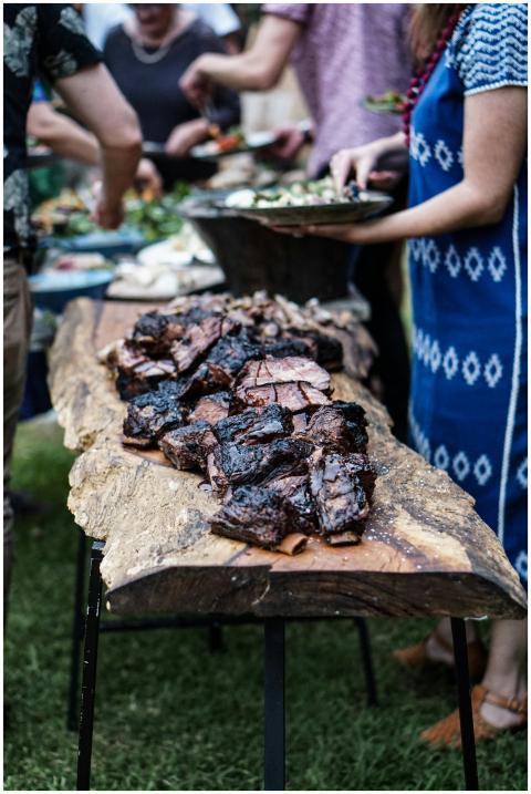 A group of people enjoying a summer barbecue with