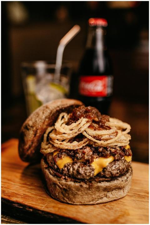 Close-up of a delicious gourmet burger topped with