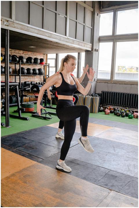 Woman performing a high-intensity workout in a wel