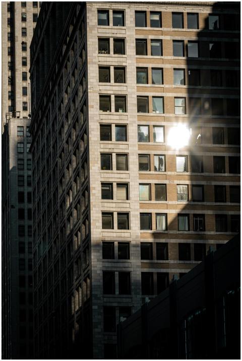 Sunlit reflections on Chicago skyscrapers create a