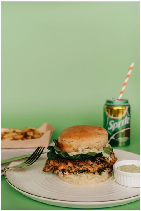 Tasty chicken burger with french fries and soda on