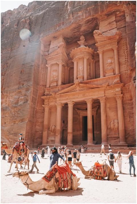Tourists and camel riders at the ancient Al Khazne