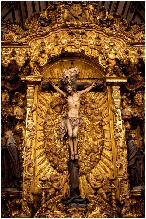 Intricate golden statue of Jesus on the cross in P