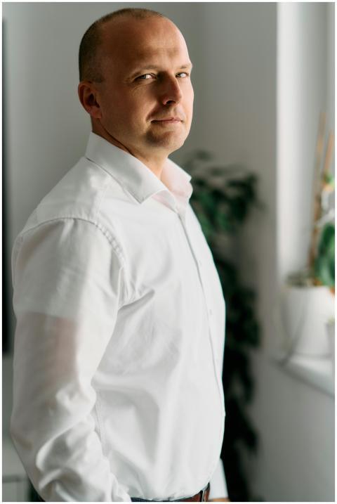 Businessman standing by a window in an office, Bra