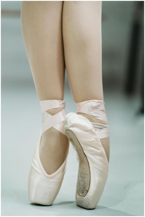 Close-up photograph of a ballerina on pointe showc