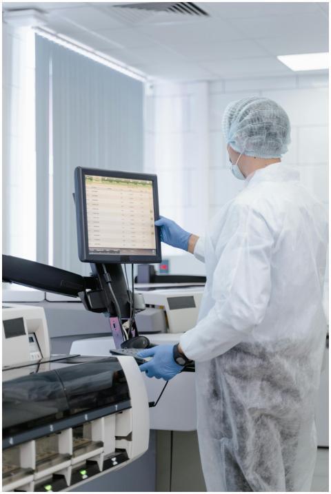 Scientist working in a lab adjusting equipment for
