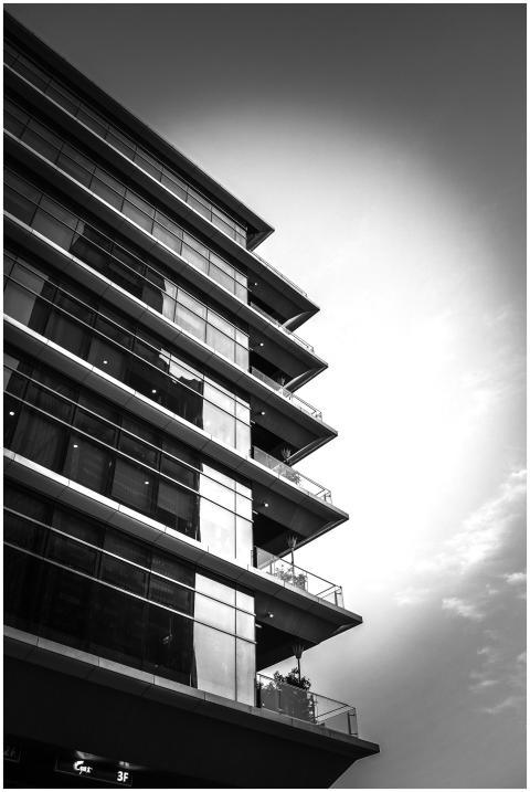 Black and white photo of a modern high-rise buildi