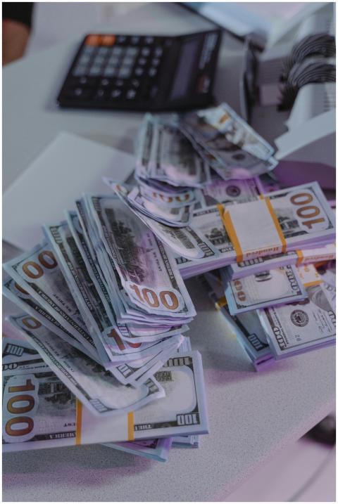 A close-up view of stacked US dollar bills next to