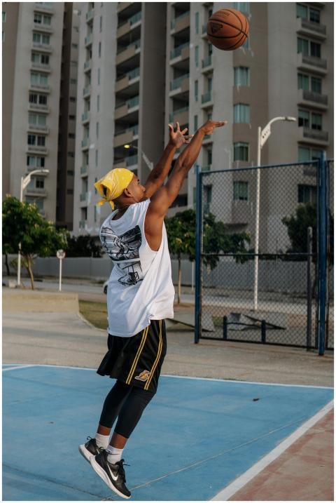 Dynamic photo of a young basketball player shootin