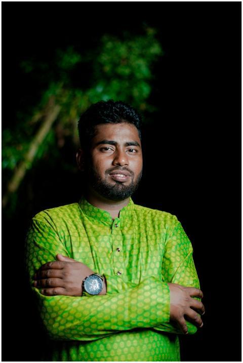 Portrait of a man in a green traditional outfit st