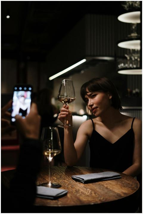 Woman enjoying a glass of white wine during a roma