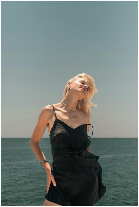 Stylish woman in black attire posing confidently b