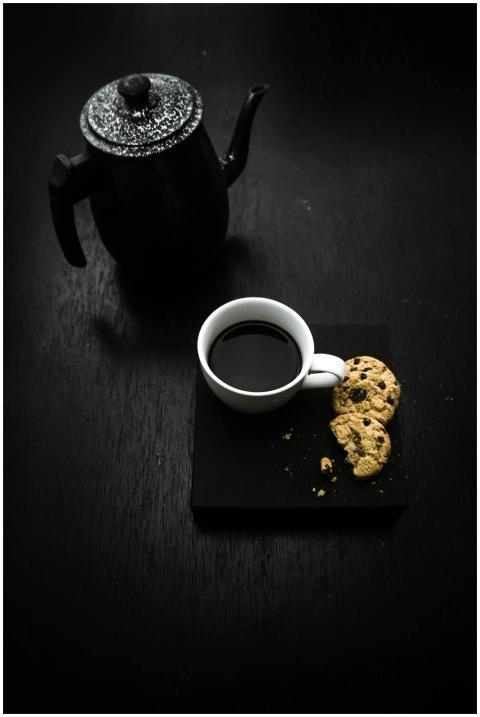 Elegant flat lay of a coffee cup with cookies and