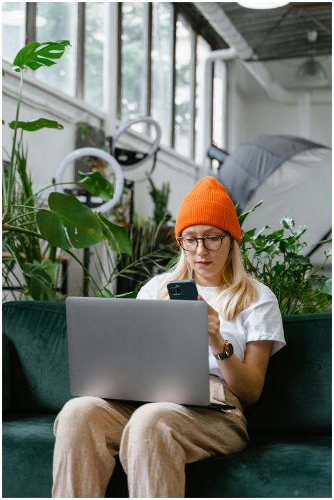 Young woman in casual attire using smartphone and