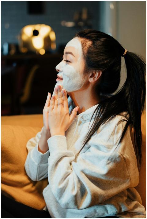 Asian woman relaxing with a face mask, practicing
