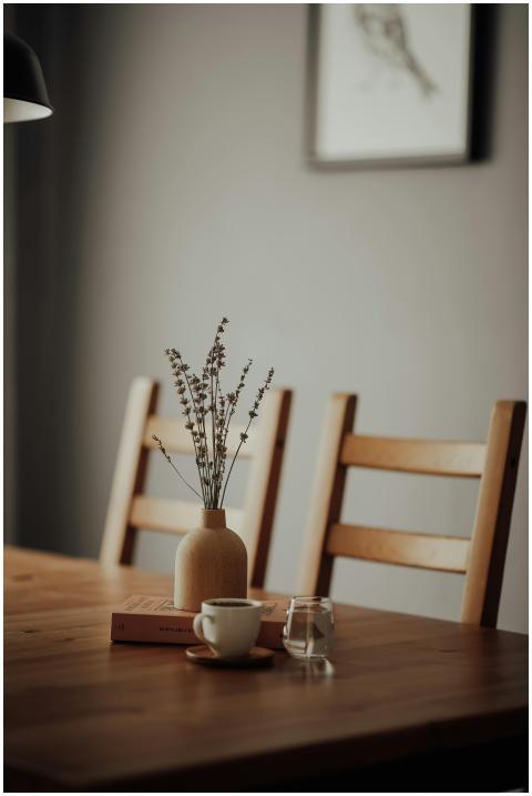 A minimalist dining setup with wooden furniture an