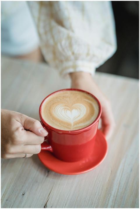 A warm cup of coffee with heart-shaped latte art i