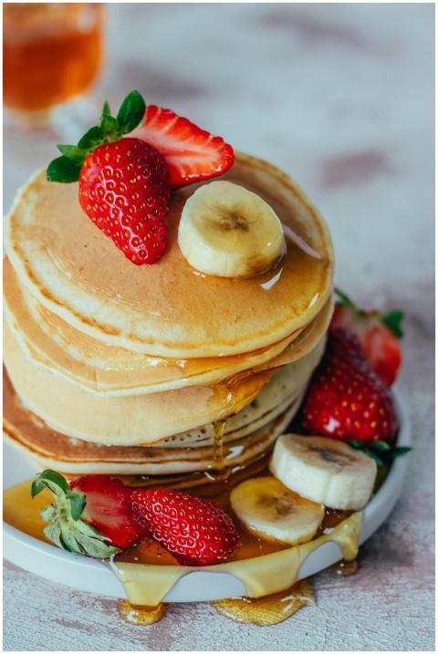 Mouthwatering stack of pancakes with strawberries