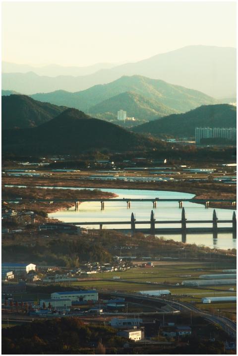 Beautiful view of mountains, river, and bridge in