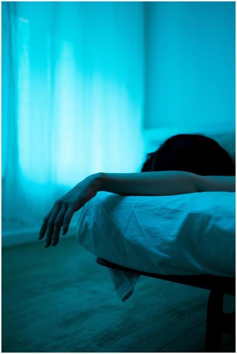 A serene and moody bedroom scene showcasing a pers