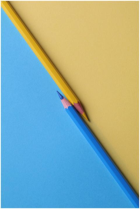 Close-up of vibrant yellow and blue colored pencil
