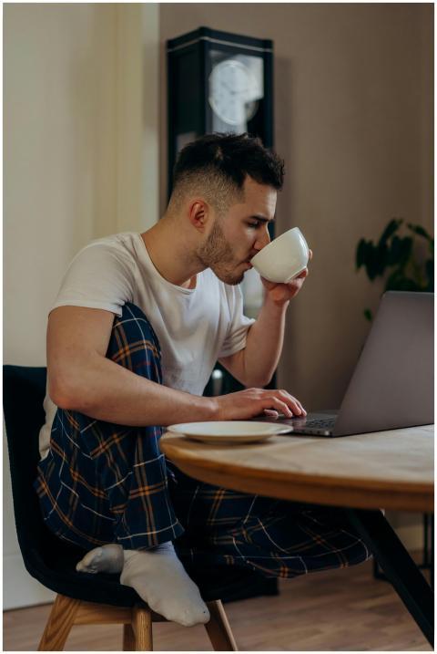 Casual work from home setup with a laptop and cup