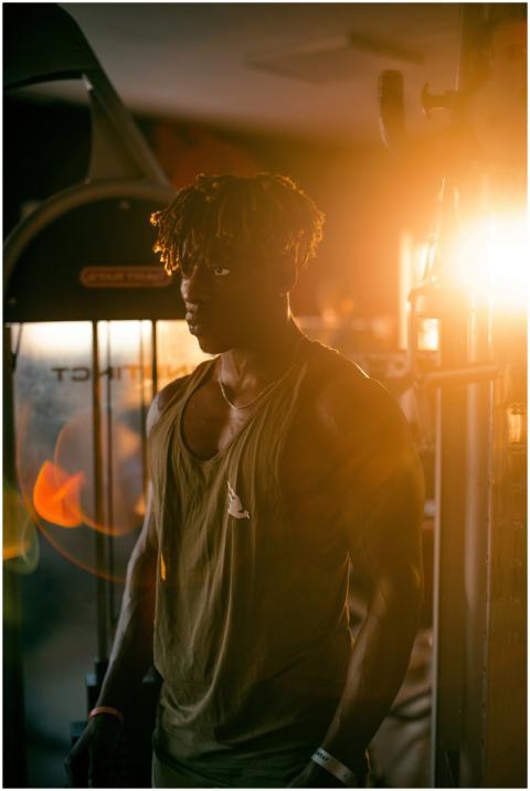 A striking gym portrait of a man in silhouette wit