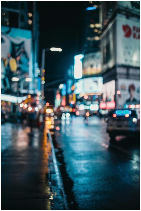 Moody, out-of-focus urban nightscape with neon cit