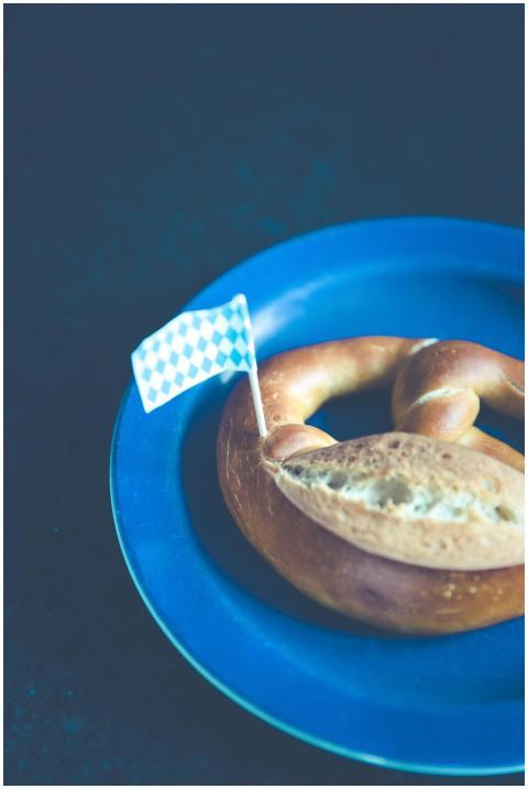 A classic Bavarian pretzel with a checkered flag o