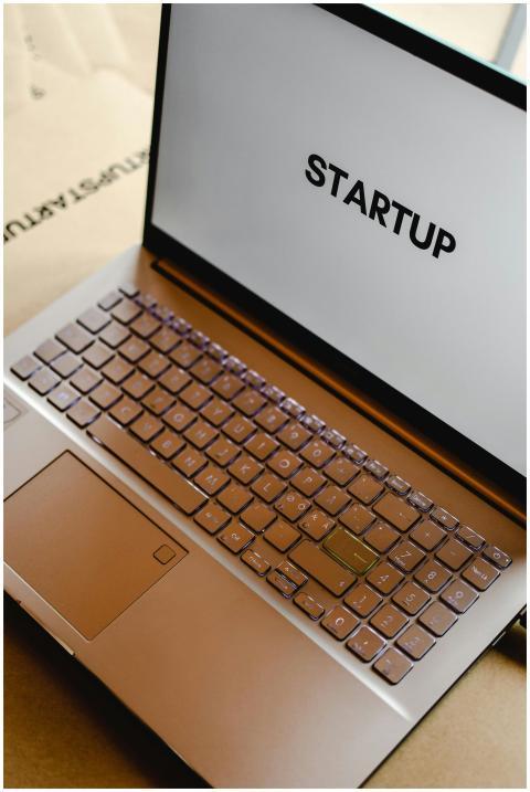 Sleek laptop displaying the word 'STARTUP', ideal