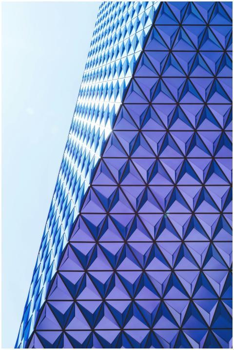 Modern building facade with triangular geometric p