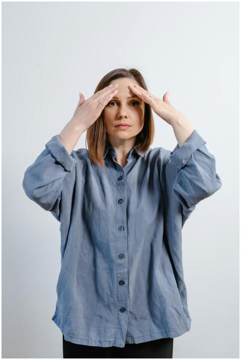 Adult woman focusing on meditation practice wearin