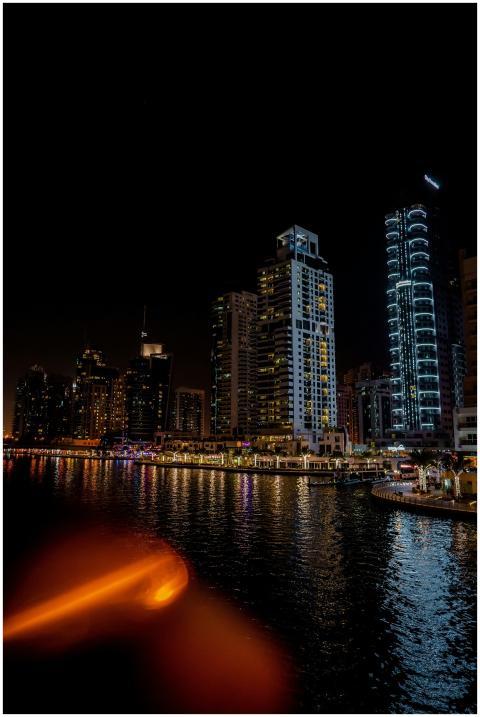 Night view of Dubai Marina's illuminated skyline r