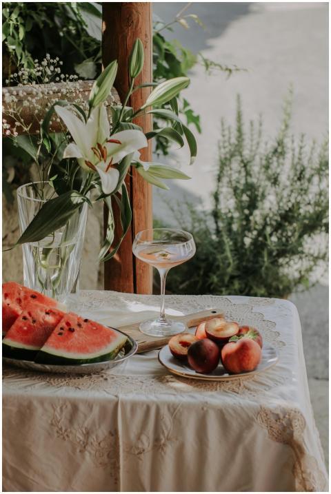 A tranquil summer scene with watermelon, peaches,