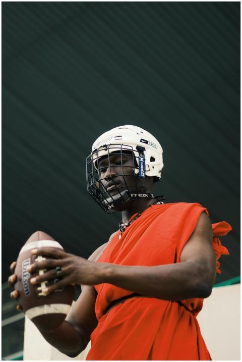 African athlete in traditional attire with helmet