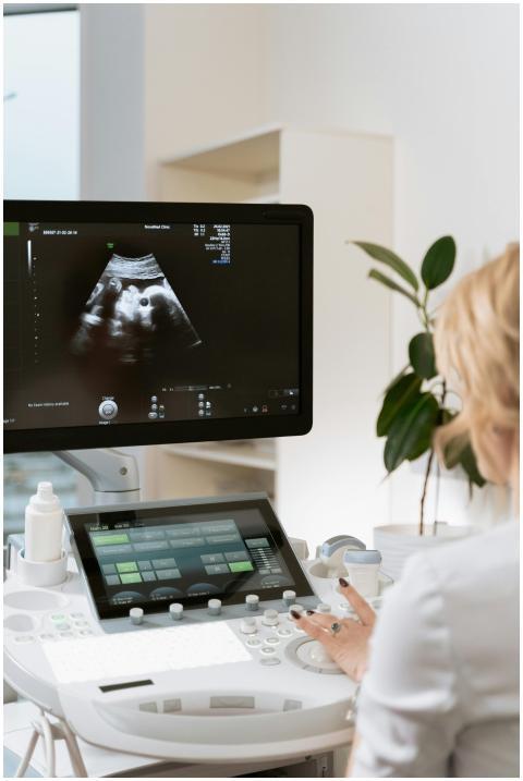 Medical professional using ultrasound equipment fo