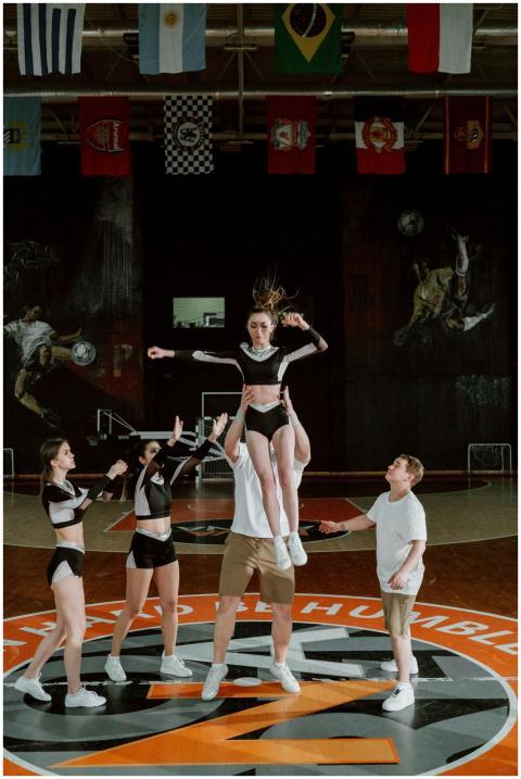 High-energy cheerleading stunt performed by teams