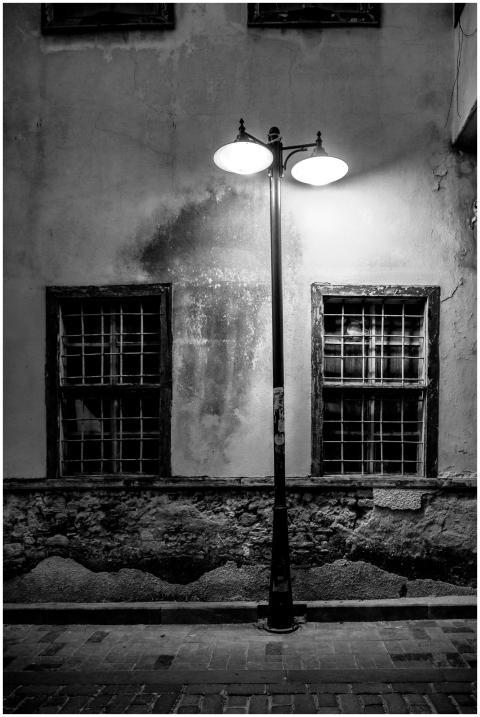 Black and white image of a vintage streetlamp illu