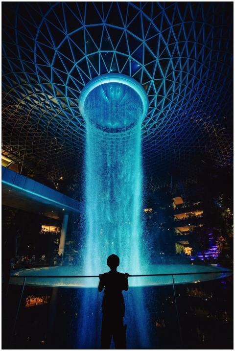 Silhouette of a person admiring the illuminated Vo