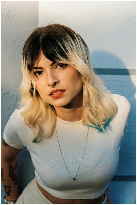 A captivating portrait of a stylish young woman wi