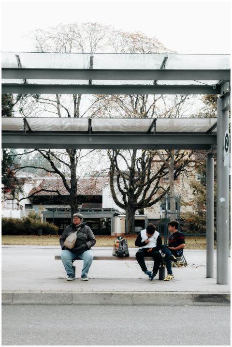 People Relaxing Bus Stop