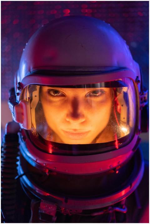 A focused female astronaut in a futuristic space s