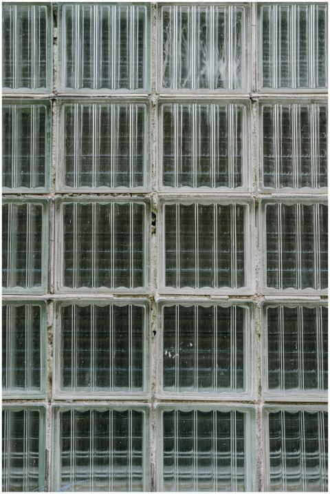 Exterior fragment of aged building with translucen