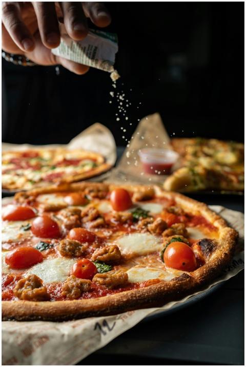 Close-up of a freshly baked pizza with cherry toma