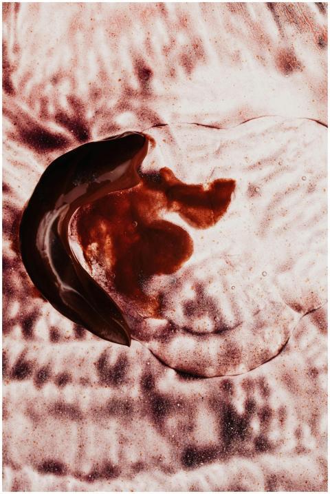 Abstract artwork featuring fluid dynamics in dark